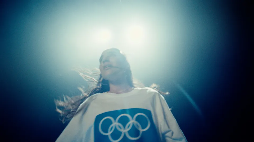 An Olympic sports fan wearing a tee-shirt with the Olympic Rings