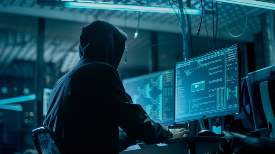 a hacker at a computer