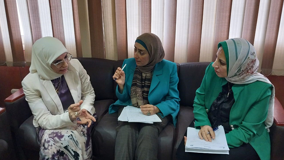 Women sitting on a sofa discussing