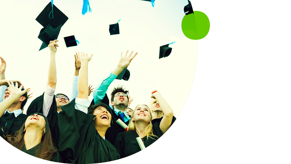 A group of students throwing graduation caps