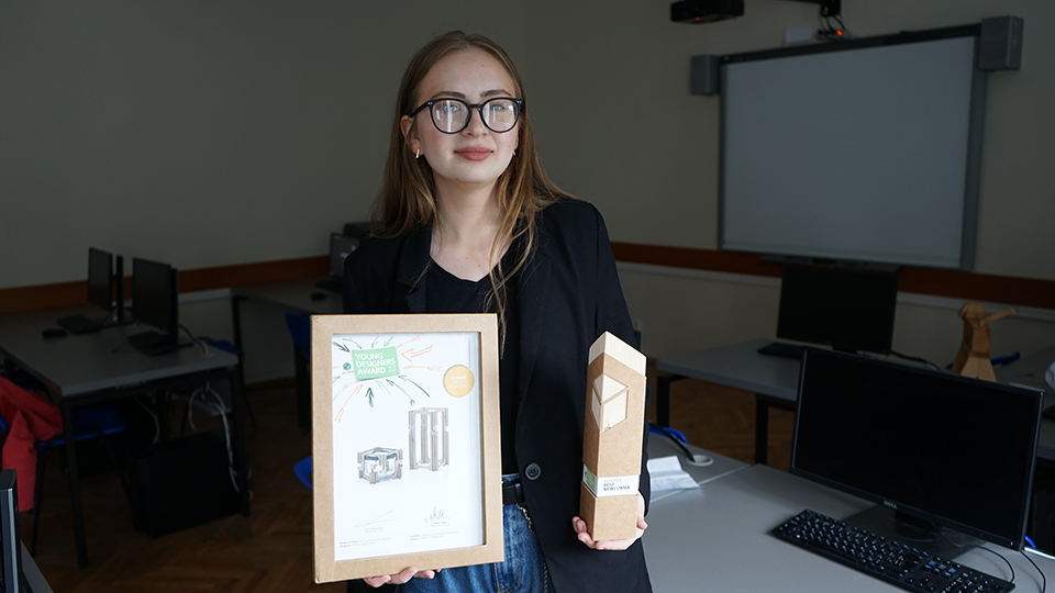 Oxana Zaporoniuc posing with her packaging design