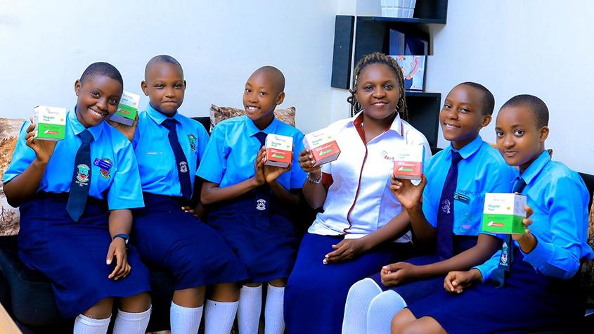 Ugandan girls showing EcoSmart products